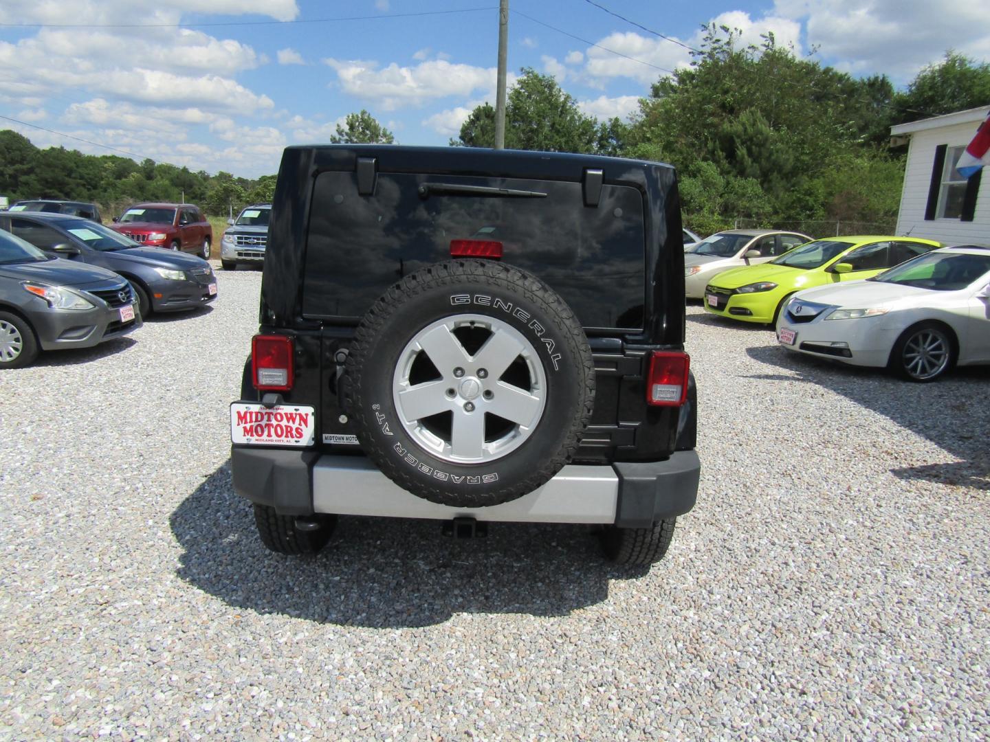 2012 Black /Tan Jeep Wrangler Sahara 4WD (1C4GJWBG2CL) with an 3.6L V6 DOHC 24V FFV engine, Automatic transmission, located at 15016 S Hwy 231, Midland City, AL, 36350, (334) 983-3001, 31.306210, -85.495277 - Photo#5